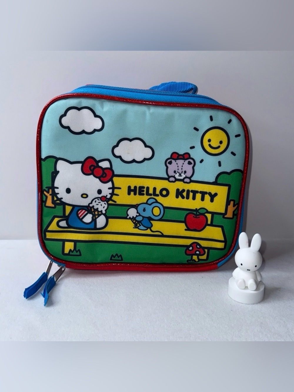 Hello Kitty Blue Lunch Bag with Red Trim and Yellow Bench Graphic